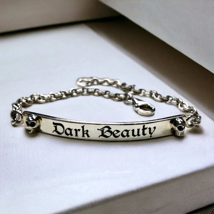 Dark Beauty Sterling Silver ID bracelet with Two Skulls