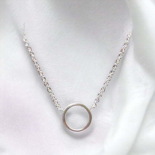 Tiny Circle Pendant in Sterling Silver